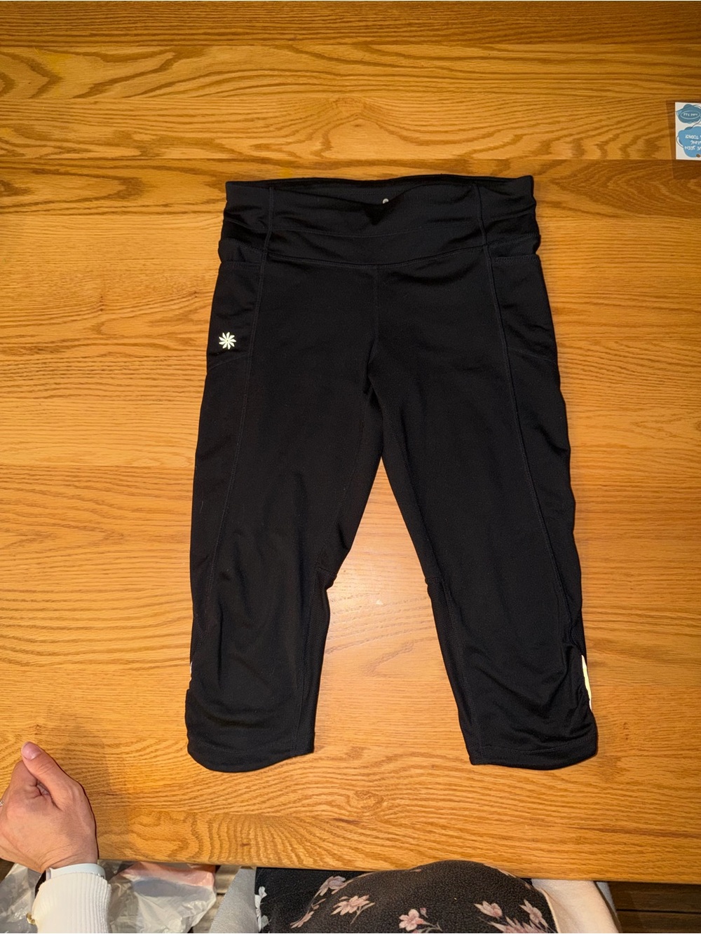 Athleta Black Capri Leggings with Small Daisy Detail
